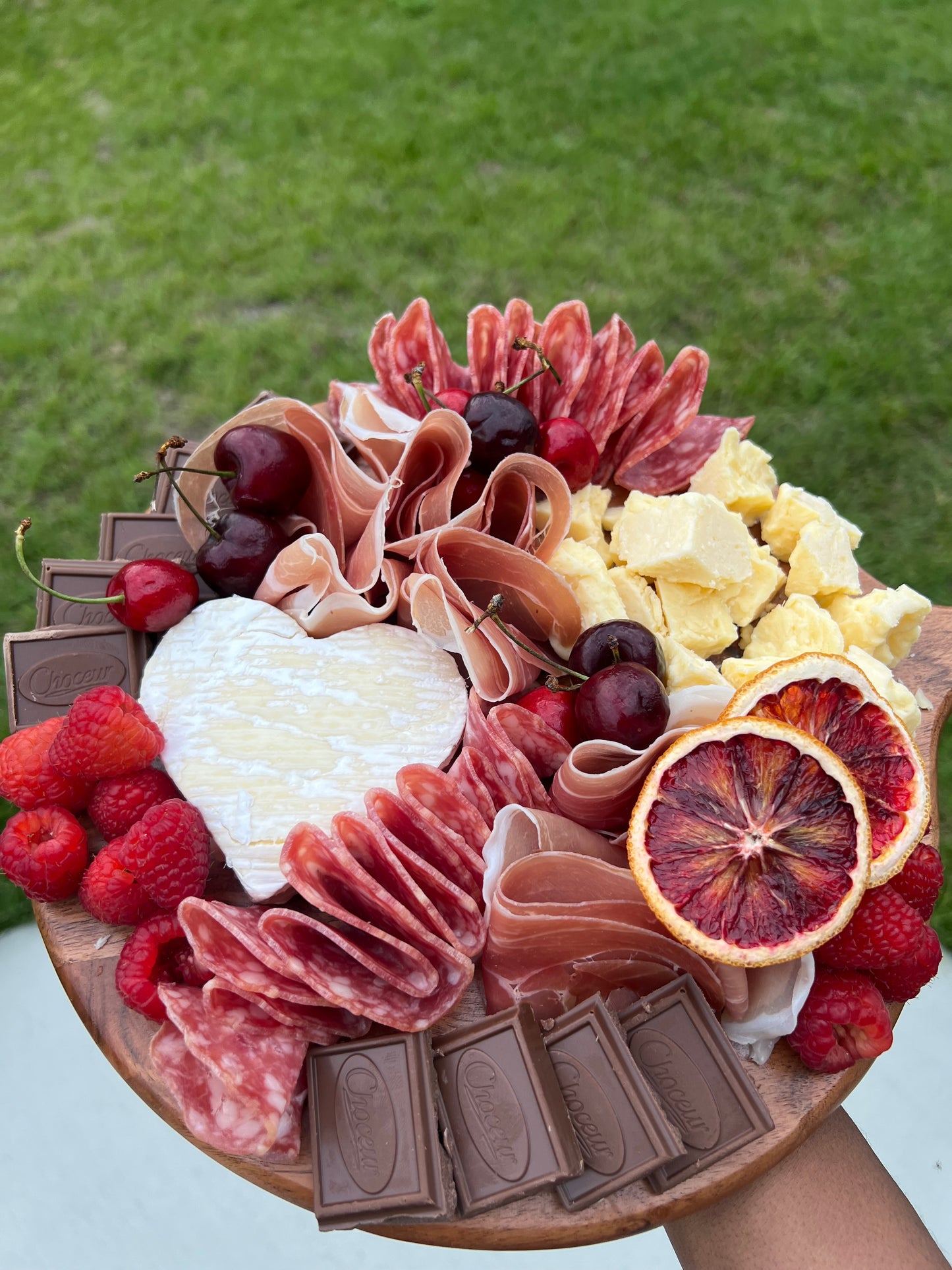 Valentine’s Day charcuterie board with cheese, meats, and chocolates