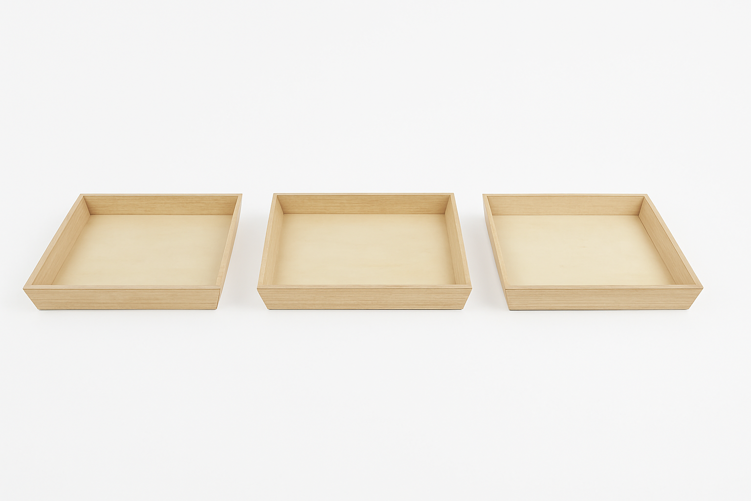 Three eco-friend disposable wood trays of different sizes on a white background